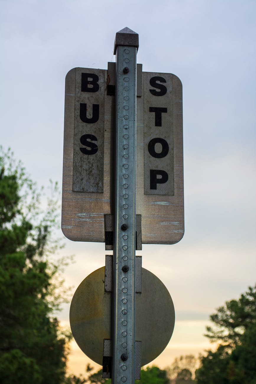 black and white bus stop sign