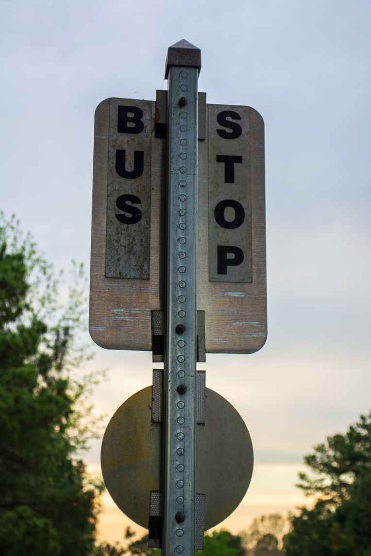 black and white bus stop sign